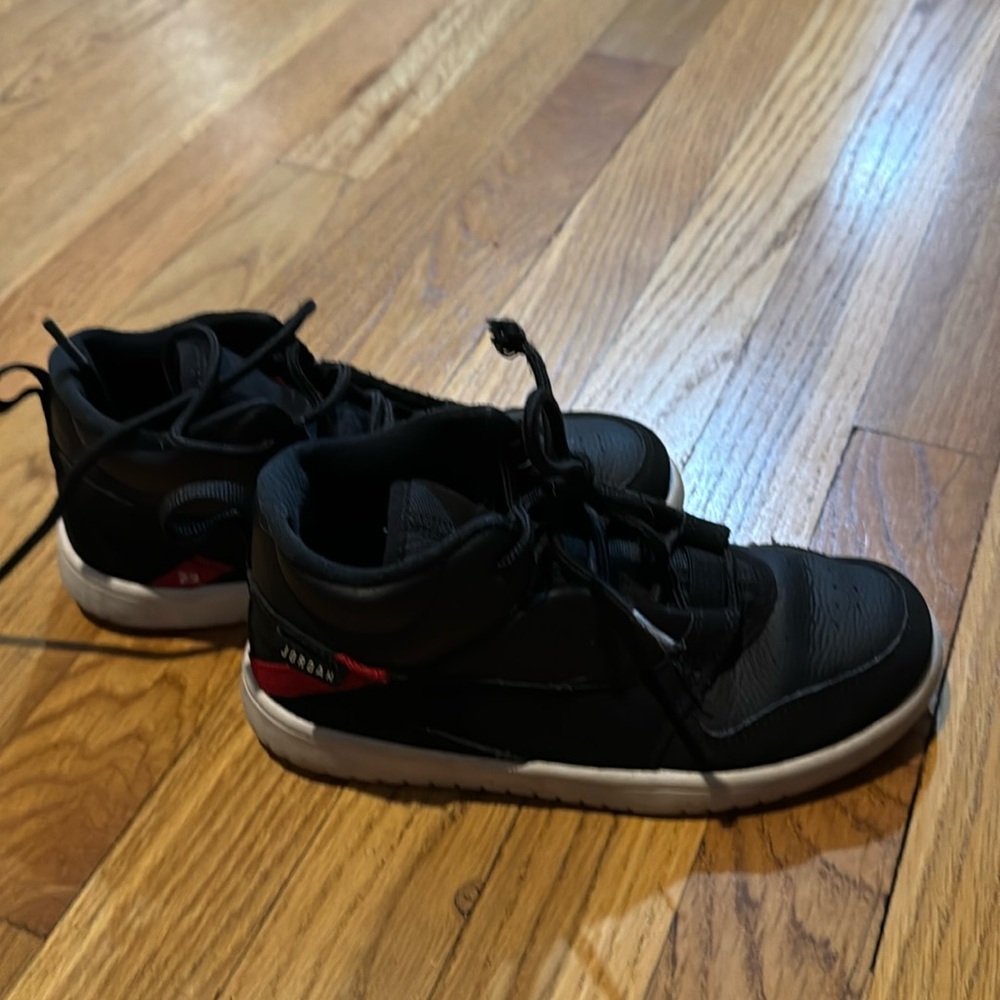 Black Jordan’s with red 23 accent kids 2.5